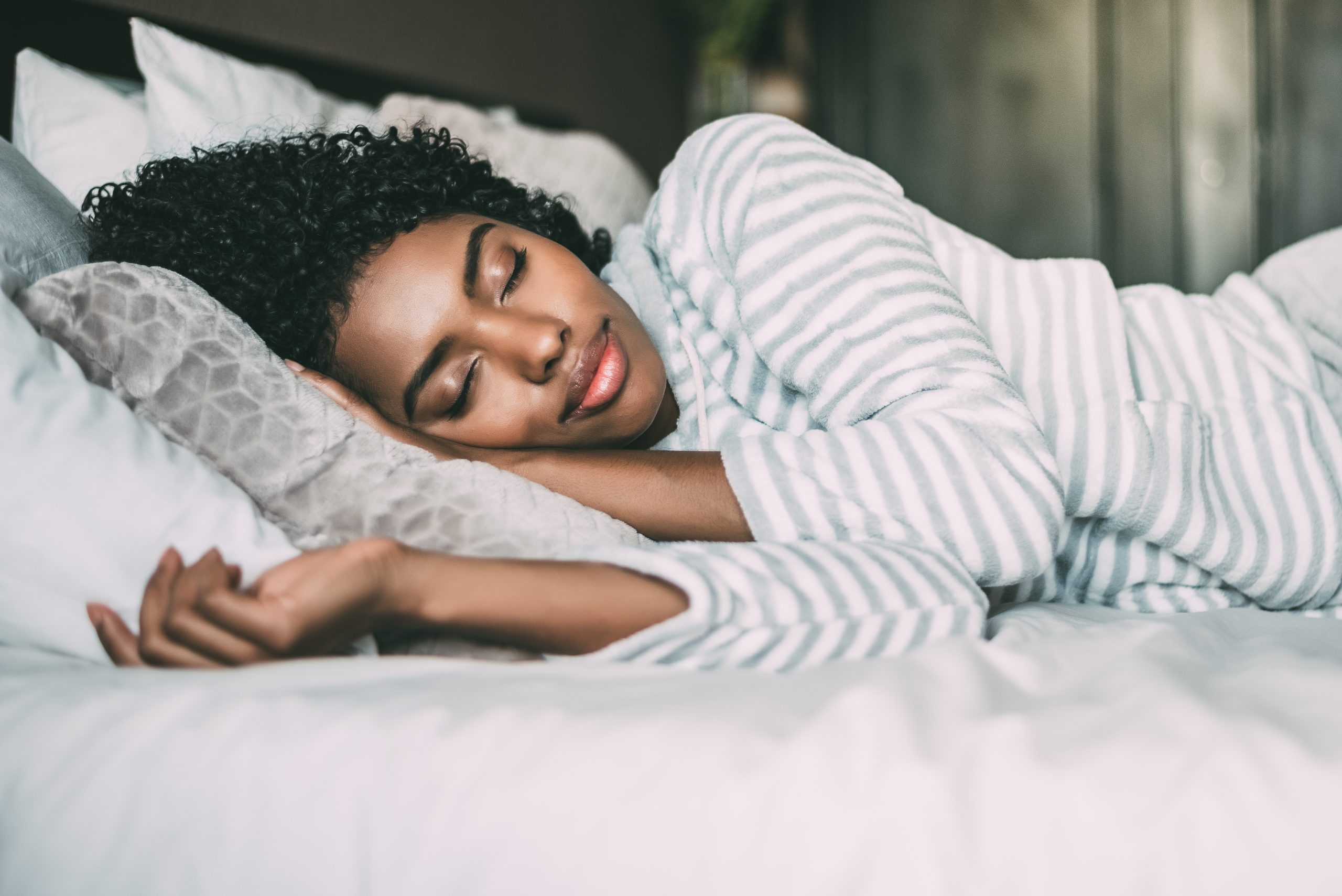 Women sleeping in a bed.